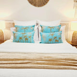 Blue Hawaii coastal boho blue cushion cover 50x50cm with gold palm tree embroidery on a turquoise background